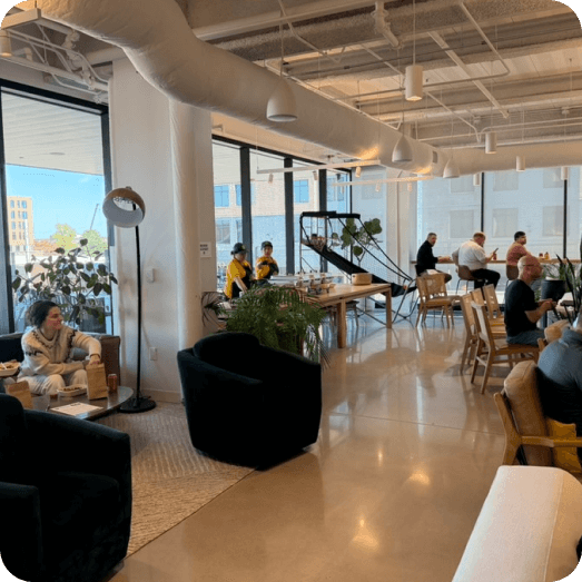 Office space with staff at tables, ready for a catered lunch